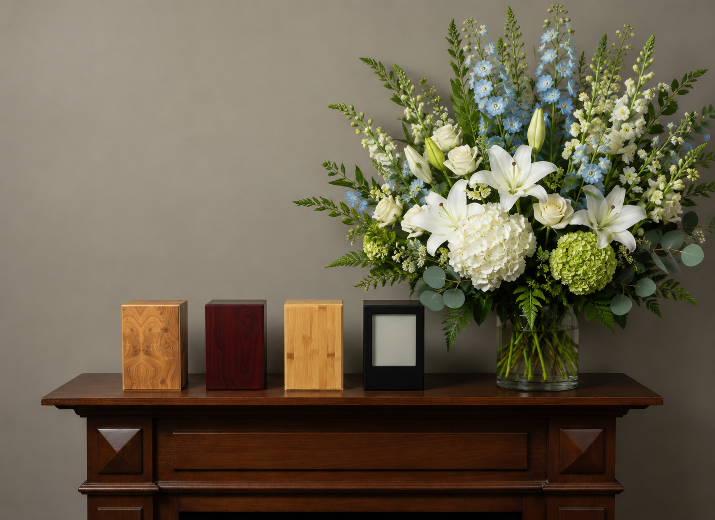 Collection of handcrafted pet memorial urn boxes with floral arrangement